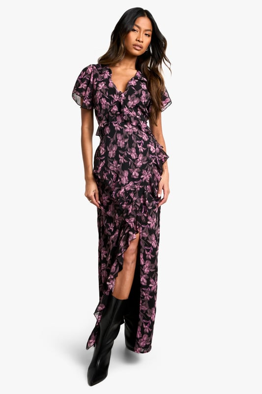 Alluring V-neckline for a feminine touch
        Flowy maxi length with a daring side slit
        Captivating floral print throughout
        Flattering wrap-style silhouette
        Short flutter sleeves for a romantic flair
    
    Make a lasting impression in this enchanting floral maxi dress, perfect for your next night out. The wrap-style silhouette gracefully hugs your curves, while the daring side slit adds a touch of allure to your ensemble. The V-neckline and short flutter sleeves create a romantic and feminine look that's sure to turn heads. Style this versatile piece with strappy heels and a clutch for a sophisticated cocktail party, or dress it down with ankle boots and a leather jacket for a chic dinner date. The maxi length offers elegance and drama, making it an ideal choice for various evening events. Whether you're dancing the night away or enjoying drinks with friends, this dress will keep you looking effortlessly stylish and ready for any urban adventure.