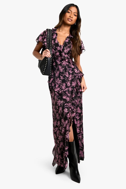 Alluring V-neckline for a feminine touch
        Flowy maxi length with a daring side slit
        Captivating floral print throughout
        Flattering wrap-style silhouette
        Short flutter sleeves for a romantic flair
    
    Make a lasting impression in this enchanting floral maxi dress, perfect for your next night out. The wrap-style silhouette gracefully hugs your curves, while the daring side slit adds a touch of allure to your ensemble. The V-neckline and short flutter sleeves create a romantic and feminine look that's sure to turn heads. Style this versatile piece with strappy heels and a clutch for a sophisticated cocktail party, or dress it down with ankle boots and a leather jacket for a chic dinner date. The maxi length offers elegance and drama, making it an ideal choice for various evening events. Whether you're dancing the night away or enjoying drinks with friends, this dress will keep you looking effortlessly stylish and ready for any urban adventure.