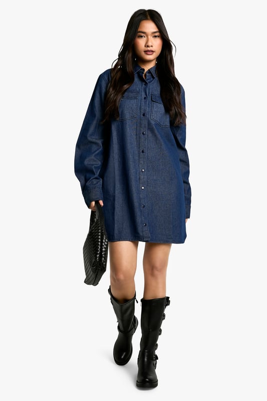 Oversized denim shirt dress for effortless style
        Classic collar and full-length button placket
        Roomy chest pockets for added functionality
        Long sleeves with buttoned cuffs for versatile wear
        Relaxed silhouette perfect for layering
    
    Embrace casual chic with this versatile oversized denim shirt dress from Boohoo. Its relaxed fit offers comfort without compromising on style, making it ideal for a range of casual occasions. Layer it over a fitted turtleneck and pair with opaque tights and ankle boots for a trendy autumn look. Alternatively, wear it unbuttoned over a crop top and cycling shorts for a laid-back summer ensemble. The classic denim fabric lends itself to easy accessorising - add a wide belt to cinch the waist or leave it loose for a more relaxed vibe. Perfect for family gatherings, weekend brunches, or casual outings with friends, this shirt dress is a wardrobe staple that can be dressed up or down to suit your mood and the occasion.