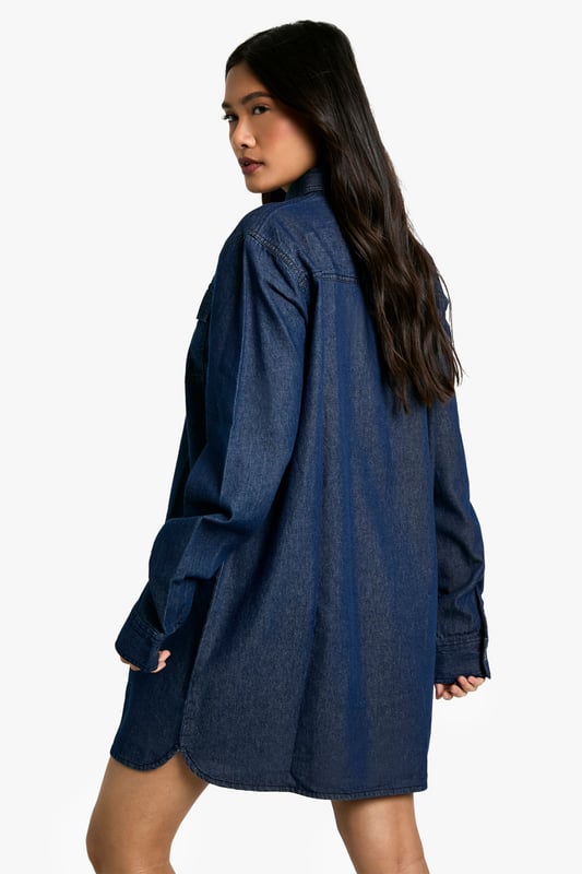 Oversized denim shirt dress for effortless style
        Classic collar and full-length button placket
        Roomy chest pockets for added functionality
        Long sleeves with buttoned cuffs for versatile wear
        Relaxed silhouette perfect for layering
    
    Embrace casual chic with this versatile oversized denim shirt dress from Boohoo. Its relaxed fit offers comfort without compromising on style, making it ideal for a range of casual occasions. Layer it over a fitted turtleneck and pair with opaque tights and ankle boots for a trendy autumn look. Alternatively, wear it unbuttoned over a crop top and cycling shorts for a laid-back summer ensemble. The classic denim fabric lends itself to easy accessorising - add a wide belt to cinch the waist or leave it loose for a more relaxed vibe. Perfect for family gatherings, weekend brunches, or casual outings with friends, this shirt dress is a wardrobe staple that can be dressed up or down to suit your mood and the occasion.