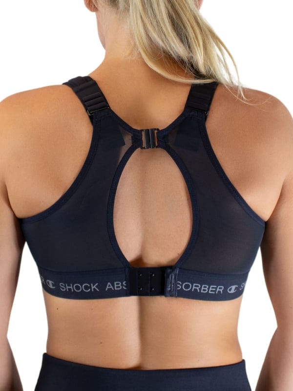 Shock Absorber Ultimate Run Padded Sports Bra. Non-wired sports bra designed for running with moisture-wicking material, wide padded racerback comfort straps, a wide underband and a double back fastening for ultimate support. Product is recommended hand-wash only.