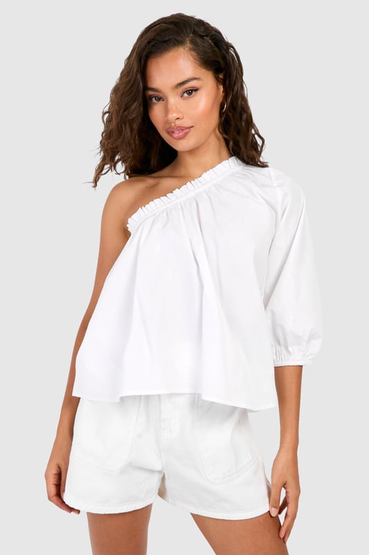 Striking one-shoulder design for a bold statement
        Voluminous puff sleeve adds dramatic flair
        Relaxed, breezy fit for effortless comfort
        Versatile woven cotton fabric for breathability
        Elastic neckline ensures a secure fit
    
    Make a stylish impact with this eye-catching one-shoulder top from Boohoo. The asymmetrical neckline creates an alluring silhouette, while the voluminous puff sleeve adds a touch of drama to your ensemble. Perfect for casual outings or family gatherings, this top effortlessly combines comfort with on-trend design. Style it with high-waisted shorts and sandals for a laid-back summer look, or dress it up with tailored trousers and statement earrings for an evening out. The lightweight cotton fabric ensures breathability, making it ideal for warm weather. Whether you're heading to a barbecue or meeting friends for brunch, this versatile piece will keep you looking chic and feeling cool. Its relaxed fit allows for easy movement, making it a go-to choice for various casual occasions.
