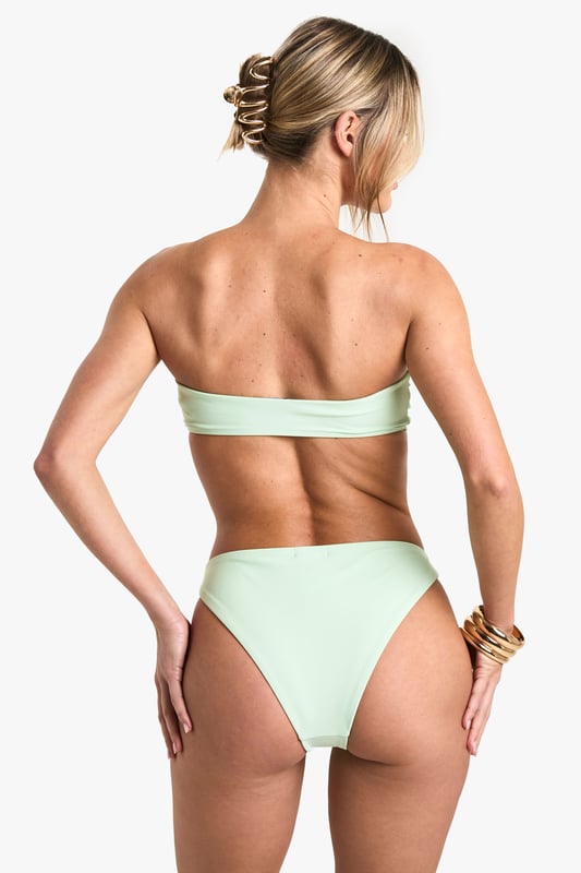 Strapless bandeau-style top with gathered centre detail
        Decorative pearl-like floral embellishment on top and bottoms
        High-cut bikini bottoms for a leg-lengthening effect
        Smooth, stretchy fabric for comfort and fit
        Coordinated two-piece design for a cohesive beach look
    
    Make waves this summer in this eye-catching bikini set that combines style and sophistication. The strapless bandeau top offers support and freedom of movement, perfect for sunbathing or a game of beach volleyball. The high-cut bottoms create the illusion of longer legs, ideal for strutting along the shoreline. The standout feature is the delicate pearl-like floral embellishment, adding a touch of glamour to your beachwear ensemble. Pair with oversized sunglasses and a wide-brimmed hat for ultimate poolside chic, or throw on a sheer kaftan and wedge sandals for a stylish transition to beachside cocktails. Whether you're jetting off to a tropical paradise or enjoying a staycation by the lido, this versatile bikini set will ensure you look and feel fabulous under the sun.