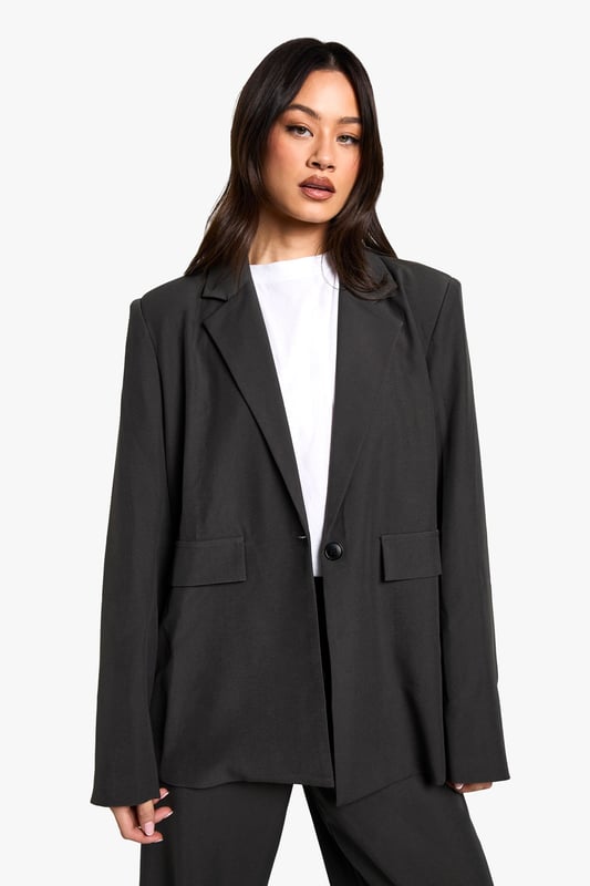 Oversized fit for a relaxed, contemporary silhouette
        Versatile blazer-dress design for multiple styling options
        Notched lapels and single-button closure for a classic touch
        Flap pockets add functional detail to the design
        Tall fit ensures proper length for taller frames
    
    Make a bold statement with this Tall Oversize Blazer-Dress from Boohoo. Perfect for the fashion-forward woman who loves to experiment with her style, this piece offers endless versatility. Wear it as a dress for a daring look that's sure to turn heads, or style it open over wide-leg trousers for a chic, modern ensemble. The oversized fit allows for layering, making it ideal for transitional weather. Pair with trainers and a baseball cap for a casual daytime look, or dress it up with heeled boots and statement jewellery for an evening out with friends. The tall fit ensures the perfect length, allowing you to style it confidently whether you're heading to a family gathering or a casual lunch date. This blazer-dress is a must-have addition to any wardrobe, offering both comfort and style for the trendsetting Boohoo girl.