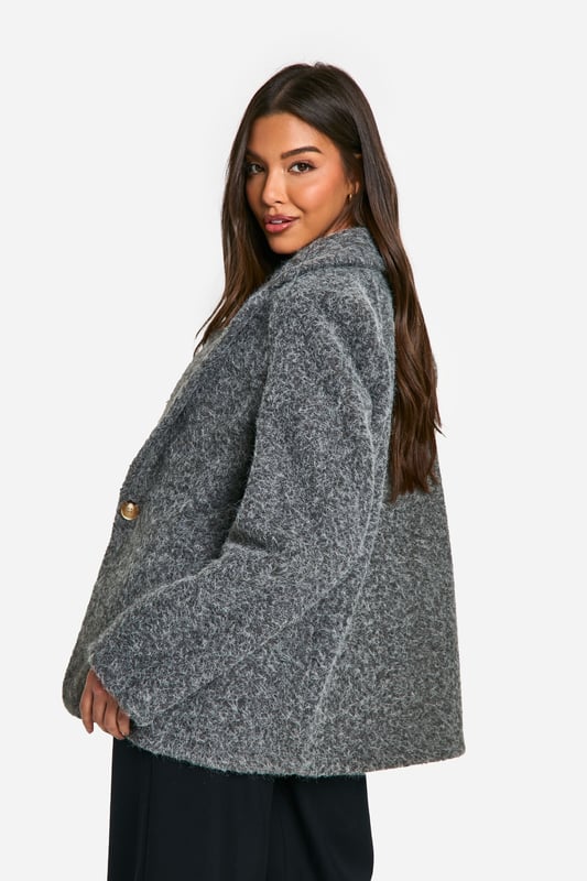 Textured wool-look blazer for a sophisticated touch
        Structured shoulder pads create a sharp silhouette
        Single-button fastening for a sleek closure
        Versatile design suitable for various occasions
        Relaxed fit allows for layering and comfort
    
    Embrace effortless style with this textured blazer, perfect for the fashion-forward woman who values both trend and versatility. The structured shoulder pads create a sharp, confident silhouette, while the relaxed fit ensures comfort for all-day wear. Style it casually over a graphic tee and wide-leg trousers for a chic daytime look, or dress it up with a silk camisole and tailored trousers for evening drinks. The single-button fastening adds a sleek touch, making it easy to transition from a laid-back family gathering to a more polished casual event. This blazer is a wardrobe essential that can be dressed up or down, making it the ideal companion for the social butterfly who needs fashion that keeps up with her vibrant lifestyle. Pair with trainers for a cool, off-duty vibe or slip on some block heels to elevate your ensemble for those impromptu after-work meetups.