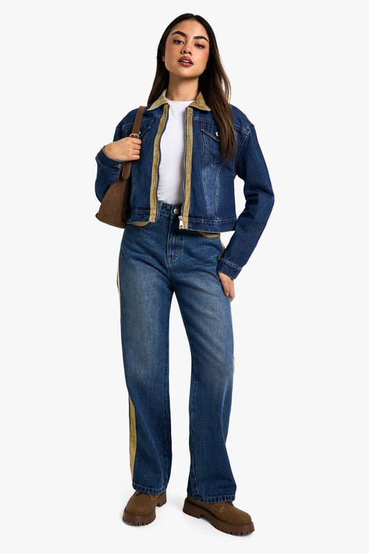 Distinctive corduroy collar and trim detailing
        Classic button-up front closure
        Functional chest pocket for added utility
        Cropped length for a modern silhouette
        Versatile denim construction for year-round wear
    
    Embrace the fusion of classic and contemporary with this eye-catching jeans jacket from Boohoo. The corduroy collar and trim inject a touch of retro charm, whilst the cropped silhouette keeps the look firmly on-trend. Perfect for layering, this jacket is a versatile piece that can be styled for various casual occasions. Pair it with high-waisted jeans and a simple white tee for a laid-back weekend look, or throw it over a floral dress and trainers for a fun family gathering. The functional chest pocket adds a practical element to the design, ideal for keeping small essentials close at hand. Whether you're heading to a casual lunch with friends or a relaxed evening out, this jacket will add an effortless cool to your ensemble. Its adaptable nature makes it a wardrobe staple that can transition seamlessly from day to night, ensuring you're always ready for wherever your social calendar takes you.