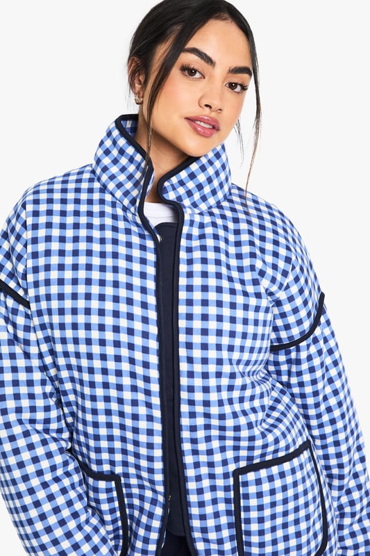 Oversized fit for a relaxed and trendy silhouette
        Eye-catching gingham print throughout
        High collar for added warmth and style
        Functional front pockets for convenience
        Versatile design suitable for layering
    
    Make a bold statement with this striking oversized jacket from Boohoo. The all-over gingham print adds a playful touch to your casual wardrobe, perfect for those who love to stay on-trend. The roomy fit allows for easy layering over your favourite jumpers or hoodies when the temperature drops. Style it with wide-leg trousers and trainers for a contemporary street-style look, or throw it over a simple dress and ankle boots for a chic daytime ensemble. Ideal for casual outings, from coffee dates to shopping trips, this jacket is a versatile piece that will quickly become a go-to in your wardrobe. Its blend of comfort and style makes it a must-have for the fashion-forward woman who values both practicality and flair in her everyday attire.