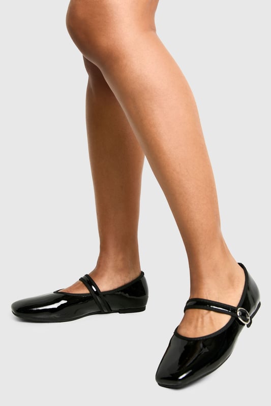 Sleek patent finish for a glossy look
        Adjustable strap with silver-tone buckle detail
        Square toe design for a modern touch
        Flat heel measuring between 0 and 2cm for all-day comfort
        Versatile style suitable for various casual occasions
    
    Step out in style with these chic lack-ballerinas from Boohoo. Perfect for the fashion-forward woman who values both trend and comfort, these flats offer a contemporary twist on a classic design. The patent finish adds a touch of sophistication, making them ideal for casual outings or relaxed office environments. Pair them with cropped trousers and a crisp white shirt for a polished daytime look, or team with a flowy sundress for a laid-back weekend ensemble. The adjustable strap ensures a secure fit, while the flat heel provides the comfort needed for long days out and about. Whether you're heading to a family gathering or meeting friends for brunch, these versatile ballerinas will keep you looking effortlessly stylish from morning to night.
