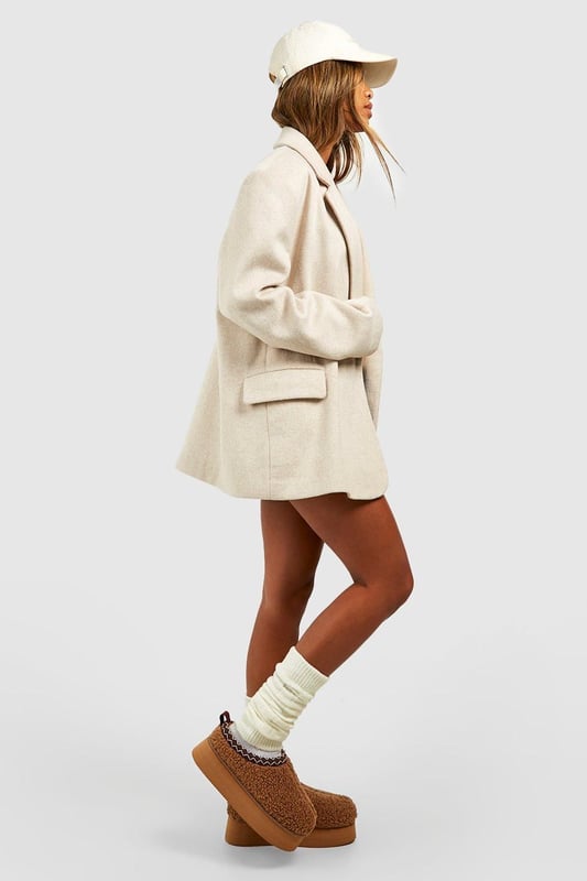 Cosy borg material for ultimate comfort
        Stylish platform design with a flat heel (0-2cm)
        Embroidered detailing adds a unique touch
        Slip-on style for easy wear
        Versatile mule silhouette for indoor and outdoor use
    
    Step into comfort and style with these eye-catching borg mules. The plush texture of the borg material envelops your feet in warmth, making them perfect for lounging at home or running quick errands. The platform design adds a trendy edge, while the flat heel ensures all-day comfort. The embroidered detailing elevates these mules from simple house shoes to a fashion statement. Pair them with your favourite joggers and an oversized jumper for a cosy day in, or style them with cropped jeans and a chunky knit for casual outings. These versatile slip-ons are ideal for family gatherings, lazy weekends, or any occasion where you want to combine comfort with a touch of flair. The easy slip-on style means you can quickly transition from indoor relaxation to outdoor adventures without missing a beat.