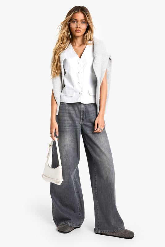 Sleek nylon vest with button-front closure
        V-neckline for a flattering silhouette
        Versatile sleeveless design
        Practical patch pockets at the waist
        Cropped length for a contemporary look
    
    Embrace effortless style with this chic nylon vest from Boohoo. Perfect for the fashion-forward woman who values both trend and versatility, this piece can easily transition from day to night. Layer it over a crisp white shirt and pair with wide-leg trousers for a polished office ensemble, or throw it on over a simple tee with your favourite jeans for a casual weekend look. The button-front closure and v-neckline add a touch of sophistication, while the cropped length keeps it current. Ideal for family gatherings or casual outings with friends, this vest is a wardrobe staple that can be dressed up or down with ease. Its lightweight nylon fabric makes it a practical choice for layering throughout the seasons, ensuring you stay on-trend whatever the weather.
