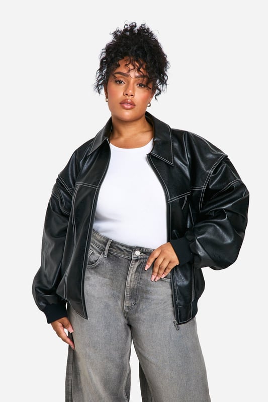 Oversized bomber jacket with striking contrast stitching
        Sleek PU material for a leather-like appearance
        Relaxed fit with dropped shoulders for comfort
        Ribbed collar, cuffs, and hem for a classic bomber silhouette
        Versatile design suitable for various casual occasions
    
    Make a bold statement with this oversized PU bomber jacket, perfect for the fashion-forward woman who loves to stand out. The contrast stitching adds a unique touch to the classic bomber silhouette, while the relaxed fit ensures comfort without compromising on style. Pair it with wide-leg trousers and trainers for a trendy daytime look, or throw it over a simple dress for an edgy evening ensemble. This versatile piece is ideal for casual outings, from coffee dates to shopping trips with friends. The jacket's adaptable nature makes it a go-to choice for family gatherings or laid-back social events. Its timeless design ensures it will remain a wardrobe staple for seasons to come, allowing you to create countless stylish combinations with ease.