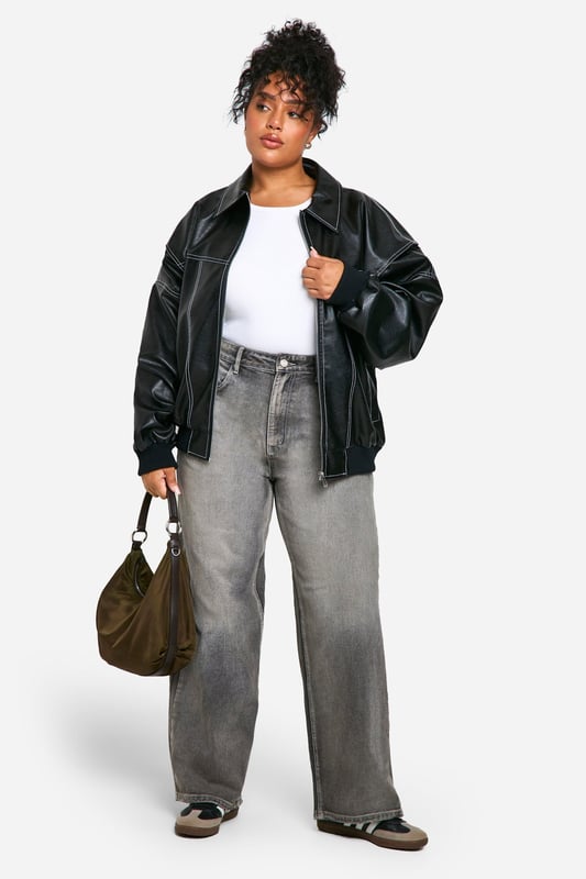 Oversized bomber jacket with striking contrast stitching
        Sleek PU material for a leather-like appearance
        Relaxed fit with dropped shoulders for comfort
        Ribbed collar, cuffs, and hem for a classic bomber silhouette
        Versatile design suitable for various casual occasions
    
    Make a bold statement with this oversized PU bomber jacket, perfect for the fashion-forward woman who loves to stand out. The contrast stitching adds a unique touch to the classic bomber silhouette, while the relaxed fit ensures comfort without compromising on style. Pair it with wide-leg trousers and trainers for a trendy daytime look, or throw it over a simple dress for an edgy evening ensemble. This versatile piece is ideal for casual outings, from coffee dates to shopping trips with friends. The jacket's adaptable nature makes it a go-to choice for family gatherings or laid-back social events. Its timeless design ensures it will remain a wardrobe staple for seasons to come, allowing you to create countless stylish combinations with ease.