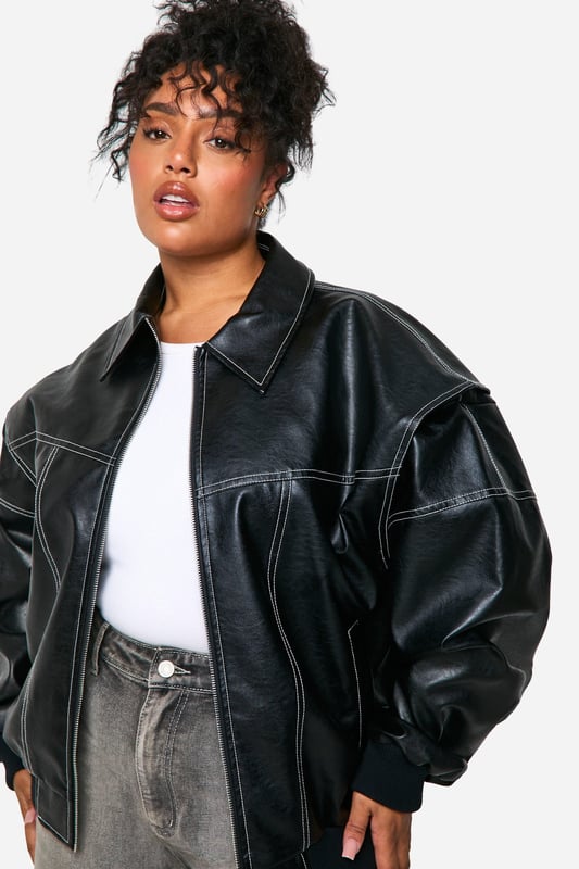 Oversized bomber jacket with striking contrast stitching
        Sleek PU material for a leather-like appearance
        Relaxed fit with dropped shoulders for comfort
        Ribbed collar, cuffs, and hem for a classic bomber silhouette
        Versatile design suitable for various casual occasions
    
    Make a bold statement with this oversized PU bomber jacket, perfect for the fashion-forward woman who loves to stand out. The contrast stitching adds a unique touch to the classic bomber silhouette, while the relaxed fit ensures comfort without compromising on style. Pair it with wide-leg trousers and trainers for a trendy daytime look, or throw it over a simple dress for an edgy evening ensemble. This versatile piece is ideal for casual outings, from coffee dates to shopping trips with friends. The jacket's adaptable nature makes it a go-to choice for family gatherings or laid-back social events. Its timeless design ensures it will remain a wardrobe staple for seasons to come, allowing you to create countless stylish combinations with ease.
