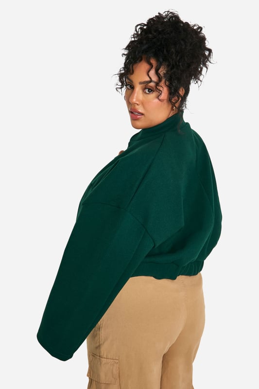 Cropped bomber jacket silhouette for a modern twist
        Distinctive seam detailing adds visual interest
        Stand-up collar for extra warmth and style
        Snap button closure for easy wear
        Relaxed fit allows for layering versatility
    
    Make a bold statement with this eye-catching plus size bomber jacket. The cropped length and distinctive seam detailing create a contemporary silhouette that's perfect for the fashion-forward woman. Layer it over a crisp white tee and pair with wide-leg trousers for a chic, casual ensemble that's ideal for weekend brunches or shopping trips with friends. The relaxed fit allows for easy movement, while the stand-up collar adds a touch of sophistication. For a night out, throw it over a sleek bodycon dress and add some statement earrings to elevate your look. This versatile piece effortlessly transitions from day to night, making it a must-have addition to your wardrobe. Whether you're heading to a casual gathering or a laid-back evening event, this bomber jacket will ensure you stand out from the crowd with its unique blend of comfort and style.