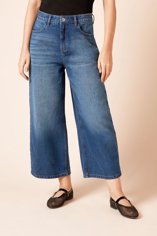 Trendy culotte-style jeans for a modern silhouette
        High-waisted design for a flattering fit
        Wide-leg cut for comfort and style
        Classic five-pocket styling
        Cropped length perfect for showcasing footwear
    
    Embrace effortless chic with these denim culotte jeans from Dorothy Perkins. The high-waisted design and wide-leg cut create a fashionable silhouette that's both comfortable and on-trend. Perfect for the woman who loves to stay current without compromising on comfort, these jeans are ideal for a variety of casual occasions. Style them with a tucked-in blouse and blazer for a smart-casual brunch with friends, or pair with a cosy jumper for a relaxed family gathering. The cropped length is perfect for showing off your favourite flats or trainers, making these jeans a versatile addition to your wardrobe. Easy to dress up or down, they're sure to become a go-to piece for your everyday style, offering that perfect balance of fashion-forward design and practical comfort that Dorothy Perkins is known for.