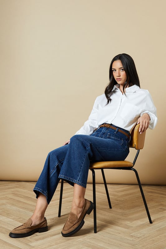 Cropped straight-leg design for a modern silhouette
        Belted waist detail adds a stylish touch
        Front patch pockets for a utilitarian-inspired look
        High-rise fit flatters the waistline
        Versatile wash suitable for various casual outfits
    
    These belted cropped straight jeans from Oasis offer a fresh take on classic denim. The high-rise fit and straight-leg cut create a flattering silhouette, while the cropped length adds a contemporary edge. Perfect for casual daywear, these jeans can be styled effortlessly for various occasions. Pair them with a crisp white shirt and sandals for a relaxed weekend look, or dress them up with a floral blouse and ankle boots for a family gathering. The front patch pockets and belted waist detail give these jeans a utilitarian-inspired charm, making them a versatile addition to your wardrobe. For a trendy double denim ensemble, team them with an oversized denim shirt as seen on the model. These jeans are ideal for those seeking a balance between comfort and style in their everyday attire.