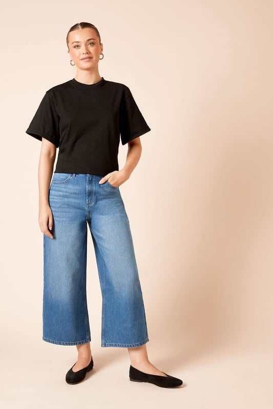 Trendy culotte-style jeans for a modern silhouette
        High-waisted design for a flattering fit
        Wide-leg cut for comfort and style
        Classic five-pocket styling
        Cropped length perfect for showcasing footwear
    
    Embrace effortless chic with these denim culotte jeans from Dorothy Perkins. The high-waisted design and wide-leg cut create a fashionable silhouette that's both comfortable and on-trend. Perfect for the woman who loves to stay current without compromising on comfort, these jeans are ideal for a variety of casual occasions. Style them with a tucked-in blouse and blazer for a smart-casual brunch with friends, or pair with a cosy jumper for a relaxed family gathering. The cropped length is perfect for showing off your favourite flats or trainers, making these jeans a versatile addition to your wardrobe. Easy to dress up or down, they're sure to become a go-to piece for your everyday style, offering that perfect balance of fashion-forward design and practical comfort that Dorothy Perkins is known for.