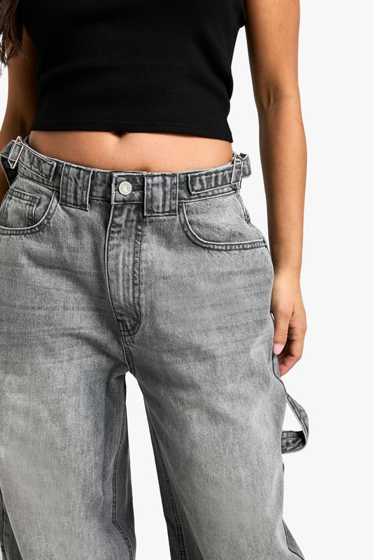 Wide-leg silhouette for a trendy, relaxed fit
        High-rise waist with belt loops for versatile styling
        Spacious side pockets and back pockets for practicality
        Durable cotton fabric for long-lasting wear
        Petite-friendly length, perfect for shorter frames
    
    Make a bold statement with these eye-catching wide-leg jeans from Boohoo's petite collection. Designed to flatter shorter frames, these trousers offer a perfect blend of comfort and style. The high-rise waist cinches you in at your smallest point, while the relaxed wide-leg cut creates a fashionable silhouette that's bang on trend. Style these versatile jeans with a cropped top and oversized jacket for a casual daytime look, or dress them up with a fitted bodysuit and heeled boots for a night out with friends. The durable cotton fabric ensures these jeans will be a wardrobe staple for seasons to come, making them ideal for everything from family gatherings to casual Fridays at the office. Embrace the latest fashion trends and showcase your unique style with these must-have petite jeans.