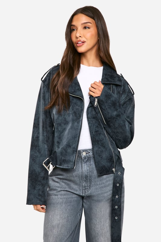 Vintage-inspired biker jacket with a distressed finish
        Asymmetrical zip front for edgy appeal
        Notched lapels and epaulettes for classic biker style
        Multiple zipped pockets for practicality and style
        Adjustable belt at hem for a customisable fit
    
    Channel your inner rebel with this vintage-inspired biker jacket from Boohoo. The distressed finish gives it a lived-in look that's perfect for adding edge to any outfit. Pair it with wide-leg jeans and a simple white tee for an effortlessly cool daytime look, or throw it over a floral dress to add some attitude to your evening ensemble. The versatile design makes it suitable for various casual occasions, from coffee dates to gigs. The multiple zipped pockets are not only stylish but practical for keeping your essentials close at hand. Whether you're heading to a family gathering or a night out with friends, this jacket will be your go-to for an instant style upgrade. Remember to keep your footwear casual - think trainers or ankle boots - to maintain the relaxed vibe this jacket embodies.