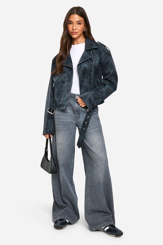 Vintage-inspired biker jacket with a distressed finish
        Asymmetrical zip front for edgy appeal
        Notched lapels and epaulettes for classic biker style
        Multiple zipped pockets for practicality and style
        Adjustable belt at hem for a customisable fit
    
    Channel your inner rebel with this vintage-inspired biker jacket from Boohoo. The distressed finish gives it a lived-in look that's perfect for adding edge to any outfit. Pair it with wide-leg jeans and a simple white tee for an effortlessly cool daytime look, or throw it over a floral dress to add some attitude to your evening ensemble. The versatile design makes it suitable for various casual occasions, from coffee dates to gigs. The multiple zipped pockets are not only stylish but practical for keeping your essentials close at hand. Whether you're heading to a family gathering or a night out with friends, this jacket will be your go-to for an instant style upgrade. Remember to keep your footwear casual - think trainers or ankle boots - to maintain the relaxed vibe this jacket embodies.