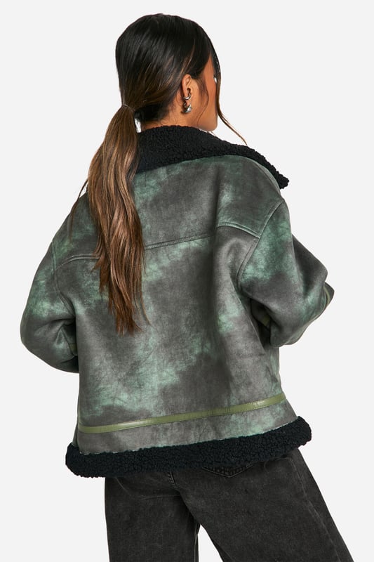 Vintage-inspired aviator jacket with a modern twist
        Cosy teddy lining for extra warmth and comfort
        Oversized fit for a relaxed, on-trend silhouette
        Asymmetrical zip closure for a unique edge
        Multiple pockets for practicality and style
    
    Embrace the cool-girl aesthetic with this striking aviator jacket. The vintage-inspired design is given a contemporary update with its oversized silhouette and asymmetrical zip closure. Perfect for those chilly autumn days, the teddy lining provides exceptional warmth without compromising on style. Pair it with wide-leg trousers and chunky trainers for an effortlessly chic daytime look. For evening outings, throw it over a little black dress and ankle boots to add an edgy contrast to your ensemble. Whether you're heading to a casual brunch or a night out with friends, this versatile piece will keep you looking fashionable and feeling cosy. The multiple pockets offer both practicality and style, making this jacket a must-have addition to your wardrobe that you'll reach for time and time again.