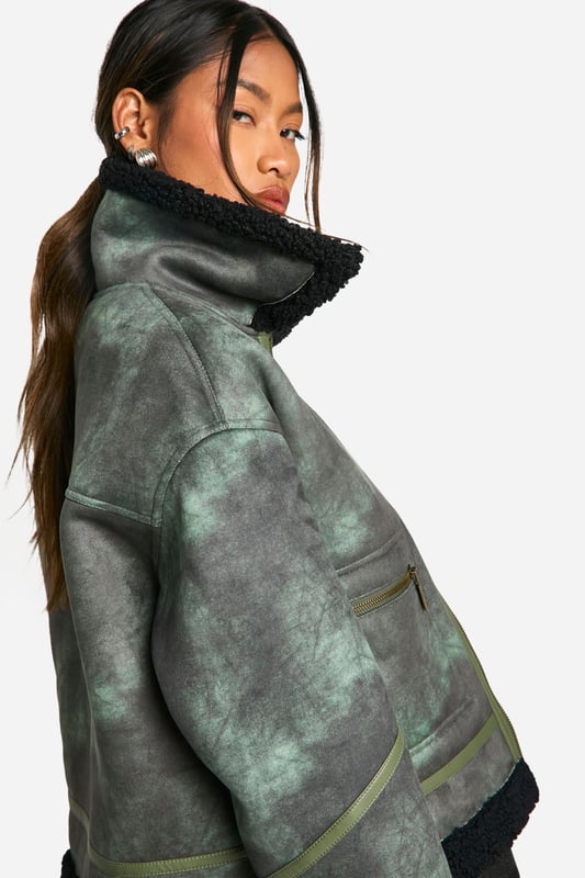 Vintage-inspired aviator jacket with a modern twist
        Cosy teddy lining for extra warmth and comfort
        Oversized fit for a relaxed, on-trend silhouette
        Asymmetrical zip closure for a unique edge
        Multiple pockets for practicality and style
    
    Embrace the cool-girl aesthetic with this striking aviator jacket. The vintage-inspired design is given a contemporary update with its oversized silhouette and asymmetrical zip closure. Perfect for those chilly autumn days, the teddy lining provides exceptional warmth without compromising on style. Pair it with wide-leg trousers and chunky trainers for an effortlessly chic daytime look. For evening outings, throw it over a little black dress and ankle boots to add an edgy contrast to your ensemble. Whether you're heading to a casual brunch or a night out with friends, this versatile piece will keep you looking fashionable and feeling cosy. The multiple pockets offer both practicality and style, making this jacket a must-have addition to your wardrobe that you'll reach for time and time again.