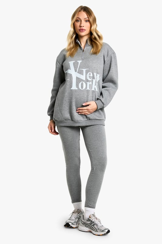 Comfortable cotton-mix fabric for all-day wear
        Bold 'New York' print on the sweatshirt for urban flair
        High-waisted leggings for a flattering silhouette
        Convenient zip detail for easy dressing
        Versatile two-piece set perfect for maternity loungewear
    
    Embrace comfort and style during your pregnancy with this chic maternity leggings set. The soft cotton-mix fabric ensures all-day comfort, while the bold 'New York' print on the sweatshirt adds a touch of urban sophistication. The high-waisted leggings provide gentle support for your growing bump, and the convenient zip detail makes dressing a breeze. Perfect for leisurewear, this versatile set can be styled for various casual outings. Pair with trendy trainers and a denim jacket for a cool mum-to-be look when running errands, or layer with a longline cardigan and slip-on shoes for a cosy day at home. The neutral grey hue allows for easy mixing and matching with your existing wardrobe, making this set a must-have for expectant mums who value both comfort and fashion-forward style.