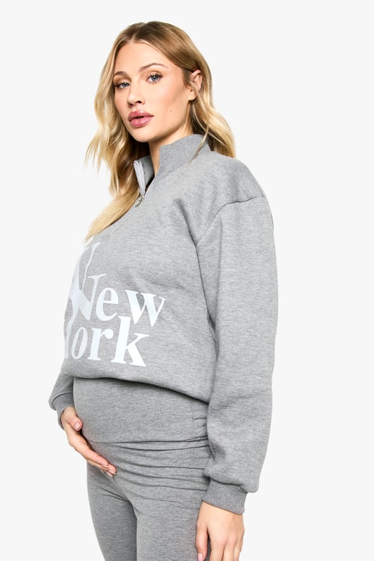 Comfortable cotton-mix fabric for all-day wear
        Bold 'New York' print on the sweatshirt for urban flair
        High-waisted leggings for a flattering silhouette
        Convenient zip detail for easy dressing
        Versatile two-piece set perfect for maternity loungewear
    
    Embrace comfort and style during your pregnancy with this chic maternity leggings set. The soft cotton-mix fabric ensures all-day comfort, while the bold 'New York' print on the sweatshirt adds a touch of urban sophistication. The high-waisted leggings provide gentle support for your growing bump, and the convenient zip detail makes dressing a breeze. Perfect for leisurewear, this versatile set can be styled for various casual outings. Pair with trendy trainers and a denim jacket for a cool mum-to-be look when running errands, or layer with a longline cardigan and slip-on shoes for a cosy day at home. The neutral grey hue allows for easy mixing and matching with your existing wardrobe, making this set a must-have for expectant mums who value both comfort and fashion-forward style.