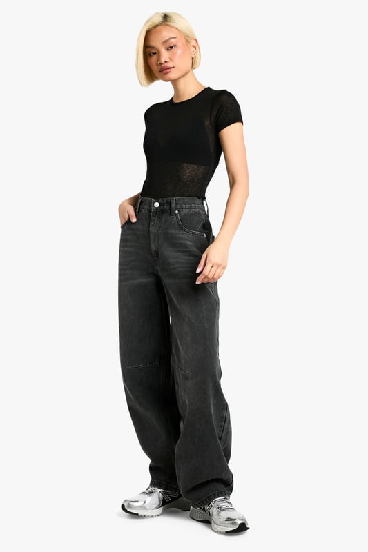Tapered fit for a modern silhouette
        Distinctive seam detailing adds visual interest
        High-rise waist with belt loops for versatile styling
        Rigid denim construction for a structured look
        Wide-leg design for a relaxed, on-trend appearance
    
    Make a bold statement with these eye-catching tapered jeans from Boohoo. The unique seam detailing sets these trousers apart, offering a contemporary twist on a classic wardrobe staple. Perfect for the fashion-forward woman who values both style and comfort, these jeans can effortlessly transition from day to night. Pair them with a cropped tee and trainers for a casual daytime look, or dress them up with a fitted bodysuit and heels for an evening out. The high-rise waist and wide-leg silhouette create a flattering shape that complements various body types. Whether you're heading to a family gathering or meeting friends for coffee, these jeans provide the ideal blend of comfort and style. Embrace the latest trends while maintaining your individual flair with these versatile and striking denim trousers.