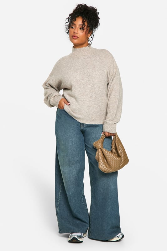 Soft, cosy high neck design for ultimate comfort
        Relaxed fit with dropped shoulders for effortless style
        Ribbed cuffs and hem for a snug, secure fit
        Versatile neutral tone suitable for various outfits
        Plus size friendly, ensuring a flattering fit for all body types
    
    Embrace laid-back luxury with this plus-size high neck jumper from Boohoo. Perfect for those chilly days when you want to feel wrapped in warmth without compromising on style. The relaxed silhouette with its dropped shoulders offers a contemporary edge, while the soft fabric ensures all-day comfort. Pair it with wide-leg jeans and trainers for a casual weekend look, or dress it up with a midi skirt and ankle boots for a cosy yet chic ensemble. This jumper is ideal for family gatherings, coffee dates with friends, or simply lounging at home. Its versatility makes it a wardrobe staple that you'll reach for time and time again. The ribbed detailing at the cuffs and hem adds a touch of refinement, ensuring the jumper maintains its shape wear after wear. Whether you're running errands or meeting friends for a casual lunch, this high neck jumper is your go-to for effortless style and comfort.