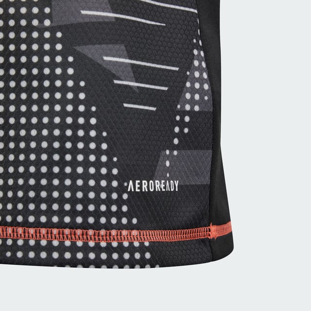 Never give an inch in goal. This juniors' adidas goalkeeper jersey is built with moisture-wicking AEROREADY for no-distraction play. An eye-catching all-over design ensures you stand out on the football pitch. A 3 Bar Logo on the chest and 3-Stripes on the shoulders show you've come to win.This product is made with 100% recycled materials. By reusing materials that have already been created, adidas help to reduce waste and our reliance on finite resources and reduce the footprint of the products adidas make.  - Regular fit - Ribbed V-neck - 100% polyester (recycled) - AEROREADY  Shipped by adidas