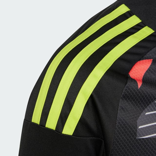 Never give an inch in goal. This juniors' adidas goalkeeper jersey is built with moisture-wicking AEROREADY for no-distraction play. An eye-catching all-over design ensures you stand out on the football pitch. A 3 Bar Logo on the chest and 3-Stripes on the shoulders show you've come to win.This product is made with 100% recycled materials. By reusing materials that have already been created, adidas help to reduce waste and our reliance on finite resources and reduce the footprint of the products adidas make.  - Regular fit - Ribbed V-neck - 100% polyester (recycled) - AEROREADY  Shipped by adidas