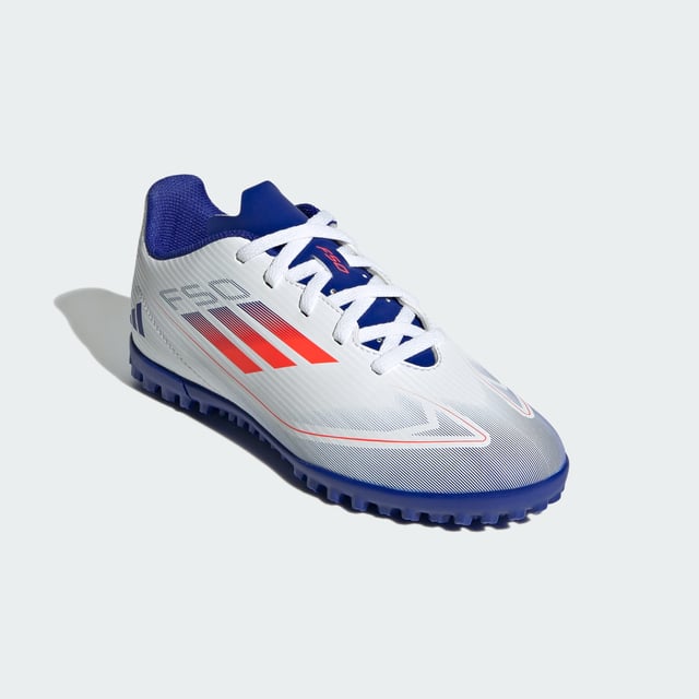 Free the fast with the adidas F50. Created to unlock the full potential of your acceleration, movement and speed. These juniors' adidas Club soccer cleats keep you comfortable with a textured synthetic upper and perforated tongue. Underneath, a lug rubber outsole ensures you stay ahead of the competition on artificial turf courts.  - Regular fit - Lace closure - Textured synthetic upper - Textile lining - Breathable perforated tongue - Rubber outsole for artificial turf  Shipped by adidas