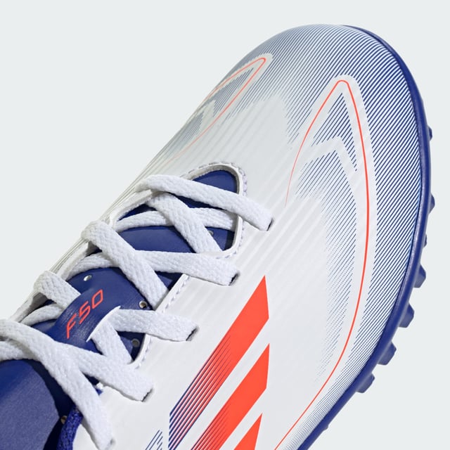 Free the fast with the adidas F50. Created to unlock the full potential of your acceleration, movement and speed. These juniors' adidas Club soccer cleats keep you comfortable with a textured synthetic upper and perforated tongue. Underneath, a lug rubber outsole ensures you stay ahead of the competition on artificial turf courts.  - Regular fit - Lace closure - Textured synthetic upper - Textile lining - Breathable perforated tongue - Rubber outsole for artificial turf  Shipped by adidas