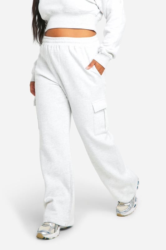 Cosy fleece-back fabric for ultimate comfort
        Cropped sweatshirt with ribbed collar and cuffs
        Straight-leg trousers with wrap-style waistband
        Convenient side pockets on trousers
        Versatile two-piece set for effortless styling
    
    Embrace laid-back chic with this Plus Sweatshirt and Straight Leg Trouser set from Boohoo. The cropped sweatshirt offers a trendy silhouette, while the straight-leg trousers with a unique wrap-style waistband add a contemporary twist to your casual wardrobe. Perfect for those lazy Sundays or running errands in style, this set is a must-have for the fashion-forward woman who values both comfort and trend-setting looks. Style it with chunky trainers and a crossbody bag for a cool, off-duty vibe, or dress it up with statement jewellery and sleek boots for a casual night out with friends. The versatility of this set makes it an ideal choice for various casual occasions, from family gatherings to weekend brunches, ensuring you look effortlessly stylish without compromising on comfort.