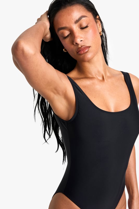 Sleek square neckline for a modern twist
        Shaping design to enhance your silhouette
        High-cut leg for elongated appearance
        Wide, comfortable straps for added support
        Versatile one-piece suitable for various beach activities
    
    Make a splash this season with our Shaping Essentials swimsuit. This chic one-piece radiates confidence and style, perfect for your next beach getaway or poolside lounge. The square neckline adds a contemporary edge, while the high-cut leg design creates the illusion of longer, leaner legs. Crafted with a shaping fabric, it smooths and sculpts your figure in all the right places, ensuring you feel your best whether you're taking a dip or soaking up the sun. The wide straps offer comfort and support for all-day wear, making it ideal for everything from leisurely swims to beach volleyball. Pair with oversized sunglasses and a wide-brimmed hat for ultimate seaside glamour, or throw on a breezy kaftan and sandals for a stylish transition from beach to bar. This versatile swimsuit is a must-have for any summer wardrobe, promising to be your go-to for countless sunny days ahead.