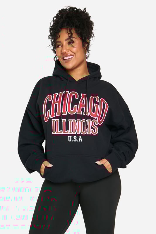 Oversized fit for ultimate comfort and style
        Bold 'Chicago Illinois USA' graphic print
        Cosy hood for added warmth
        Practical front pocket for essentials
        Versatile jersey fabric suitable for various casual occasions
    
    Make a statement with this eye-catching oversized hoodie, perfect for those who want to showcase their love for the Windy City. The bold graphic print takes centre stage, adding a touch of urban flair to your casual wardrobe. Pair it with your favourite leggings and trainers for a laid-back look that's ideal for weekend brunches or casual meet-ups with friends. The roomy fit allows for easy layering, making it a great choice for unpredictable British weather. Whether you're running errands or lounging at home, this hoodie offers both style and comfort. Its versatility shines through as it can be dressed up with dark jeans and ankle boots for a night out at the local pub, or kept casual with joggers for a cosy night in. The front pocket is perfect for keeping your hands warm or storing small essentials, while the hood provides extra protection on breezy days.