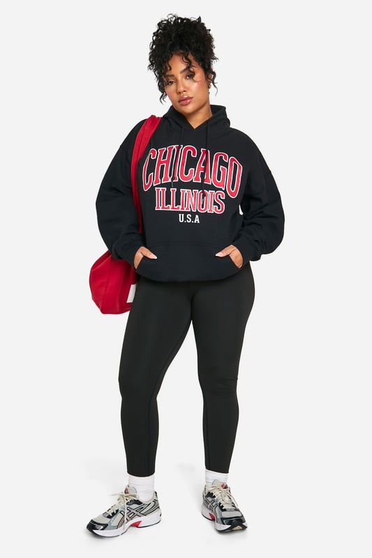 Oversized fit for ultimate comfort and style
        Bold 'Chicago Illinois USA' graphic print
        Cosy hood for added warmth
        Practical front pocket for essentials
        Versatile jersey fabric suitable for various casual occasions
    
    Make a statement with this eye-catching oversized hoodie, perfect for those who want to showcase their love for the Windy City. The bold graphic print takes centre stage, adding a touch of urban flair to your casual wardrobe. Pair it with your favourite leggings and trainers for a laid-back look that's ideal for weekend brunches or casual meet-ups with friends. The roomy fit allows for easy layering, making it a great choice for unpredictable British weather. Whether you're running errands or lounging at home, this hoodie offers both style and comfort. Its versatility shines through as it can be dressed up with dark jeans and ankle boots for a night out at the local pub, or kept casual with joggers for a cosy night in. The front pocket is perfect for keeping your hands warm or storing small essentials, while the hood provides extra protection on breezy days.