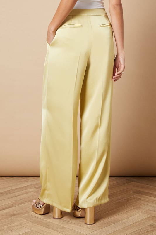 Luxurious satin fabric for a smooth, elegant finish
        Wide leg silhouette for a dramatic, flowing look
        High-waisted design with a tailored fit
        Side pockets for practicality and style
        Floor-skimming length for a sophisticated appearance
    
    Make a statement at your next formal event with these stunning wide leg tailored trousers from Oasis. The satin fabric lends a luxurious sheen that catches the light beautifully as you move, whilst the wide leg cut creates a striking silhouette that's both comfortable and chic. Perfect for weddings, races, or any occasion that calls for elegance, these trousers can be styled in numerous ways. For a coordinated look, pair with the matching blazer as shown, or create contrast with a fitted blouse. The high-waisted design elongates your legs, especially when worn with heels. Accessorise with delicate jewellery to complement the trousers' refined aesthetic. These versatile trousers transition effortlessly from day to night, making them a valuable addition to your occasion wear wardrobe.