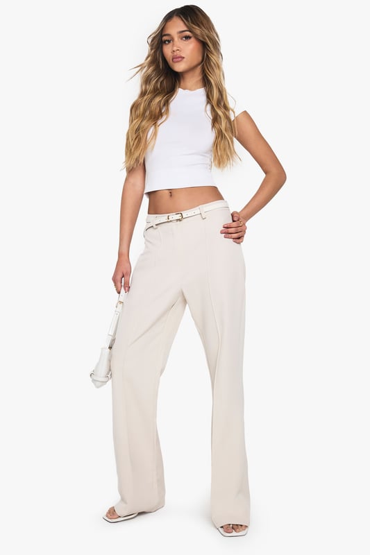 Flared leg design for a retro-inspired silhouette
        High-waisted fit for a flattering and elongating effect
        Smooth, stretchy fabric for all-day comfort
        Belt loops for optional accessorising
        Versatile style suitable for various casual occasions
    
    Make a statement with these eye-catching flared trousers from Boohoo. Perfect for the fashion-forward woman who loves to embrace trends, these trousers offer a nod to 70s style while remaining thoroughly modern. The high-waisted design elongates your silhouette, while the flared leg adds drama to your look. Pair with a cropped top as shown for a balanced silhouette, or try with a fitted bodysuit for a sleek evening ensemble. The stretchy fabric ensures comfort for all-day wear, whether you're heading to a casual lunch or a night out with friends. Dress them up with heeled sandals and statement jewellery, or keep it casual with trainers and a denim jacket. These versatile trousers are a must-have addition to any fashion-lover's wardrobe, offering endless styling possibilities for the season ahead.