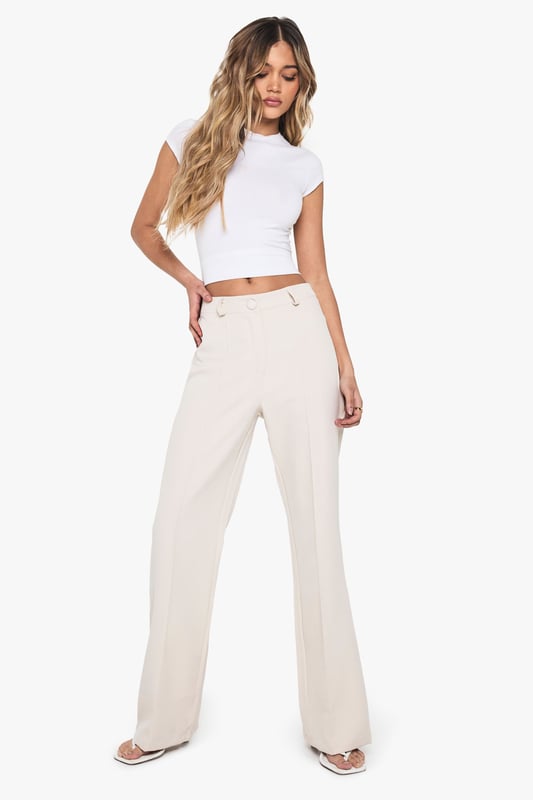 Flared leg design for a retro-inspired silhouette
        High-waisted fit for a flattering and elongating effect
        Smooth, stretchy fabric for all-day comfort
        Belt loops for optional accessorising
        Versatile style suitable for various casual occasions
    
    Make a statement with these eye-catching flared trousers from Boohoo. Perfect for the fashion-forward woman who loves to embrace trends, these trousers offer a nod to 70s style while remaining thoroughly modern. The high-waisted design elongates your silhouette, while the flared leg adds drama to your look. Pair with a cropped top as shown for a balanced silhouette, or try with a fitted bodysuit for a sleek evening ensemble. The stretchy fabric ensures comfort for all-day wear, whether you're heading to a casual lunch or a night out with friends. Dress them up with heeled sandals and statement jewellery, or keep it casual with trainers and a denim jacket. These versatile trousers are a must-have addition to any fashion-lover's wardrobe, offering endless styling possibilities for the season ahead.