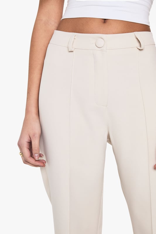Flared leg design for a retro-inspired silhouette
        High-waisted fit for a flattering and elongating effect
        Smooth, stretchy fabric for all-day comfort
        Belt loops for optional accessorising
        Versatile style suitable for various casual occasions
    
    Make a statement with these eye-catching flared trousers from Boohoo. Perfect for the fashion-forward woman who loves to embrace trends, these trousers offer a nod to 70s style while remaining thoroughly modern. The high-waisted design elongates your silhouette, while the flared leg adds drama to your look. Pair with a cropped top as shown for a balanced silhouette, or try with a fitted bodysuit for a sleek evening ensemble. The stretchy fabric ensures comfort for all-day wear, whether you're heading to a casual lunch or a night out with friends. Dress them up with heeled sandals and statement jewellery, or keep it casual with trainers and a denim jacket. These versatile trousers are a must-have addition to any fashion-lover's wardrobe, offering endless styling possibilities for the season ahead.