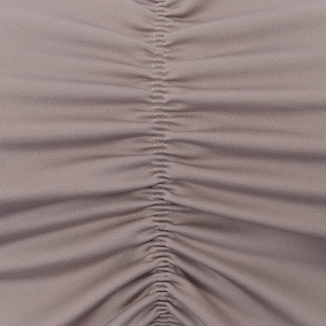 Reebok Cropped Top: Made of 85% Polyester and 15% Elastane. It features a V-neck, ruched front, Reebok logo print on the reverse, cropped length, and slim fit.