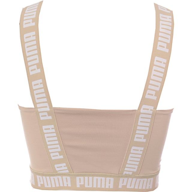 Main: 90% Polyester, Main: 10% Elastane. The Puma Training Strong crop top is a stylish and functional piece for your workout wardrobe. With its square neckline and stone-neutral color, it offers a chic look that doesn't sacrifice comfort or performance. The branding on the straps and band adds a bold touch, making it clear that you're wearing a piece designed for those who take their training seriously. Whether you're hitting the gym or just enjoying a casual day out, this crop top is sure to make a statement.