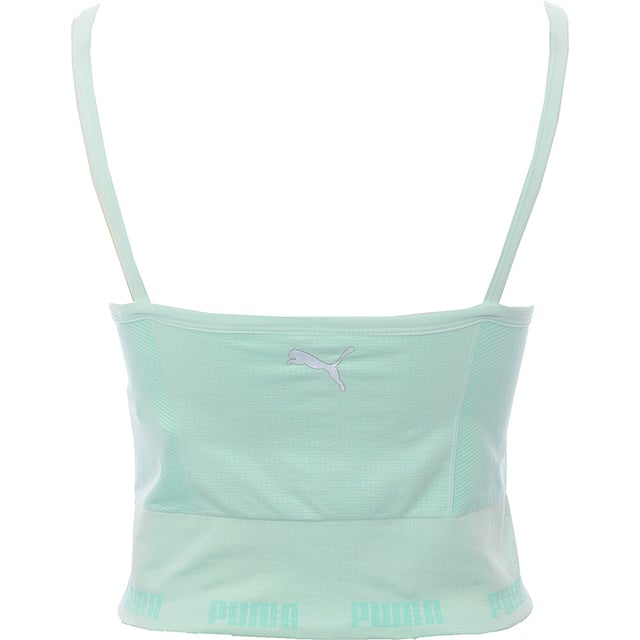 Main: 94% Nylon, Main: 6% Elastane. The Puma Training Evoknit seamless sports bra in aqua is a stylish and functional piece of activewear, perfect for light-impact activities. Its seamless design reduces friction, ensuring comfort during workouts, while the thin straps and Puma logo on the back add a touch of sporty elegance. The stretchy underband provides a secure fit, making it a great choice for those who value both performance and fashion in their gym wardrobe.