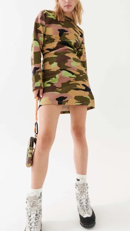 40% Cotton, 34% Organic Cotton &amp; 26% Polyester. Mini dress in a camo print. Long sleeves and a rounded neckline