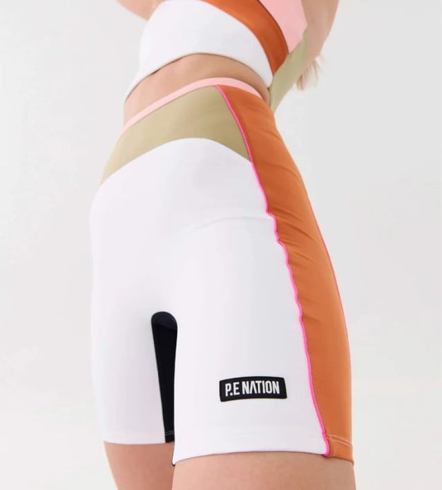 60% polyester &amp; 40% elastane. Sitting high on the waist with a 7â€ length for a comfortable and wearable fit. Completed with an understated P.E Nation logo patch at the hem