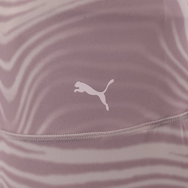 Main: 77% Polyester, Main: 23% Elastane. The Puma Studio yoga high-waisted leggings in a mauve swirl pattern are a perfect blend of style and comfort for your yoga sessions. The high waist offers support while the unique swirl pattern adds a touch of elegance, making you stand out in your yoga class. These leggings are not just about looks; they're designed to enhance your movements and provide the flexibility you need for any pose. Whether you're a beginner or a seasoned yogi, these leggings are sure to become a cherished part of your yoga journey.