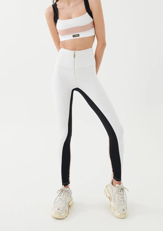 90% Organic Cotton &amp; 10% Elastane. High rise full length legging with an organic cotton fabrication. Premium stretch and recovery. Gold plated faux zipper centre front and gold plated zippers at ankles. P.E Nation logo patch
