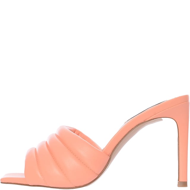 Upper: 100% Polyurethane, Lining: 100% Polyurethane, Sole: 100% Rubber. The Steve Madden Tempt heeled mules in peach are a stunning choice for anyone looking to add a touch of elegance and height to their outfit. With their sleek stiletto heel and easy slip-on design, these mules are not only stylish but also comfortable and versatile, making them perfect for both office wear and evening outings. The natural peach hue offers a subtle yet chic look that can complement a wide range of colors and styles in your wardrobe.